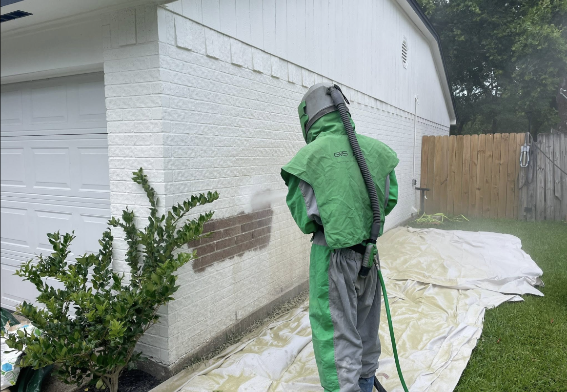 we used our mobile sandblasting to blast painted brick walls on this house to restore the natural brick on this houston home